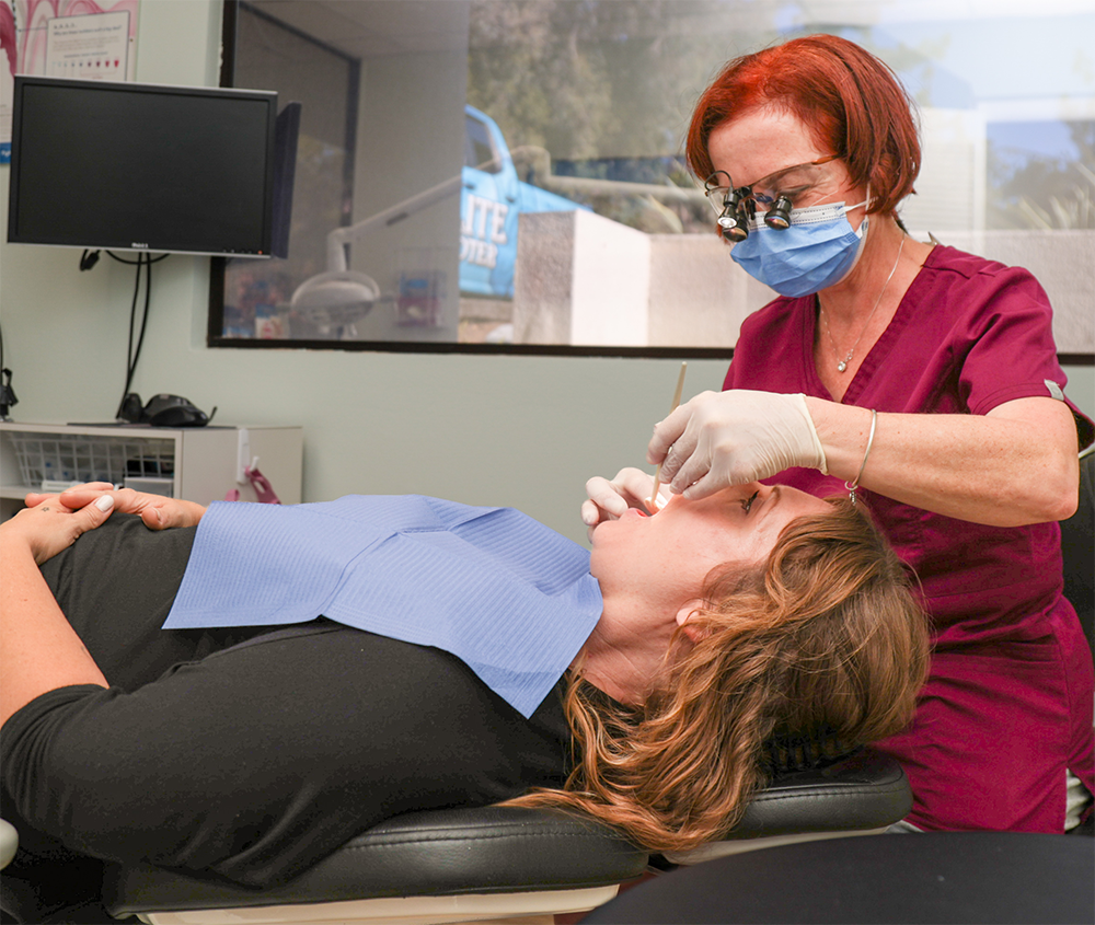 Dentist treating patient
